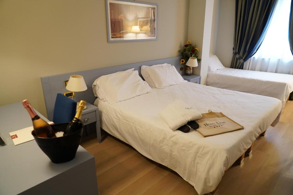 Postel nebo postele na pokoji v ubytování Hotel Lemi