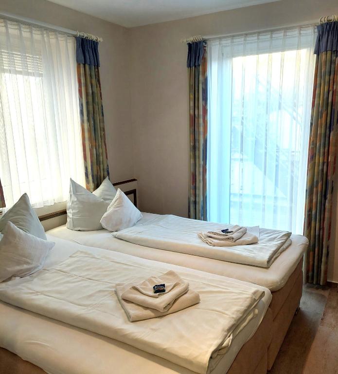 Postel nebo postele na pokoji v ubytování Hotel Villa Weststrand