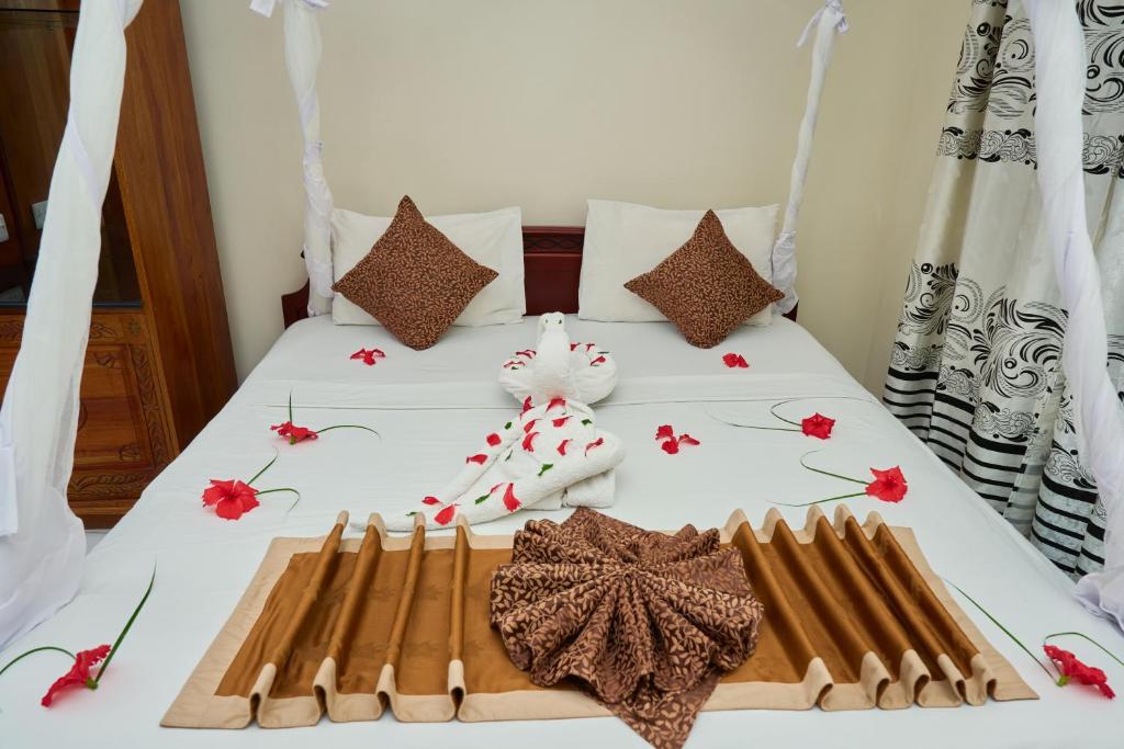 Postel nebo postele na pokoji v ubytování Safari Lodge