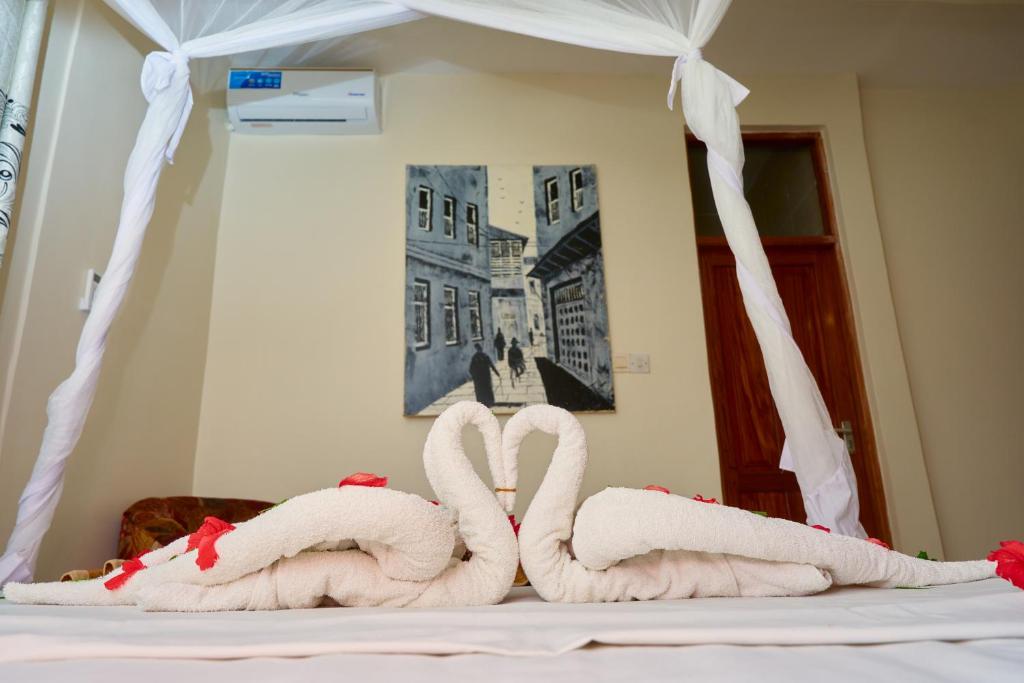 Postel nebo postele na pokoji v ubytování Safari Lodge