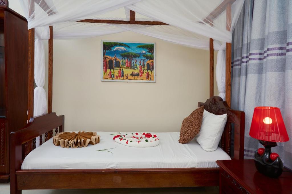 Postel nebo postele na pokoji v ubytování Safari Lodge