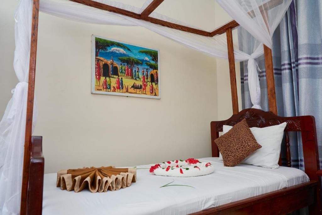 Postel nebo postele na pokoji v ubytování Safari Lodge