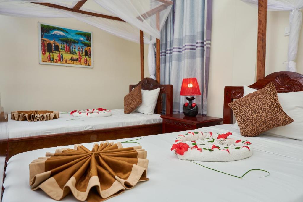 Postel nebo postele na pokoji v ubytování Safari Lodge