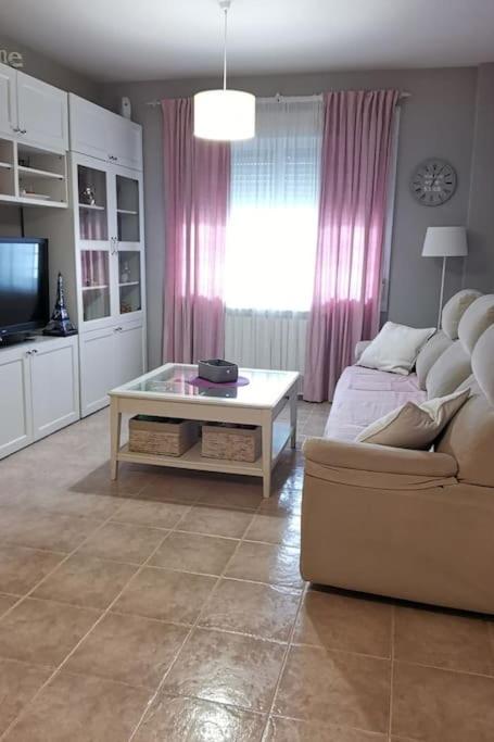 a living room with a couch and a coffee table at Casa Emma in Poblete