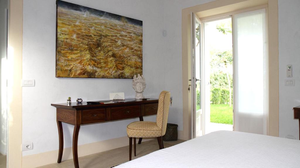 Postel nebo postele na pokoji v ubytování Donna Coraly Country Boutique Hotel