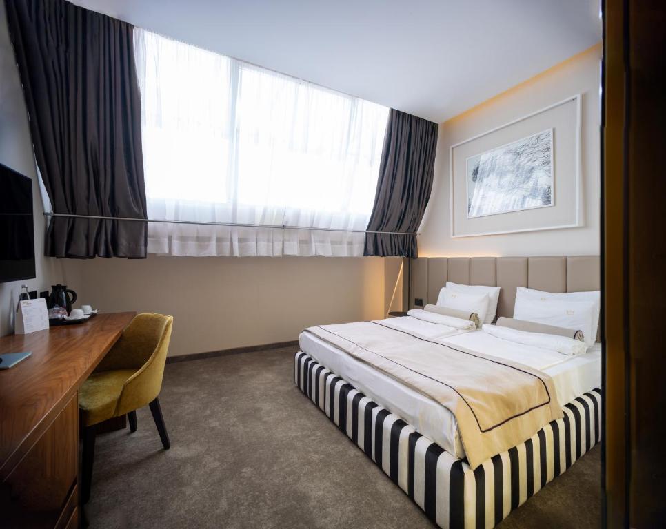Postel nebo postele na pokoji v ubytování Maison Royale
