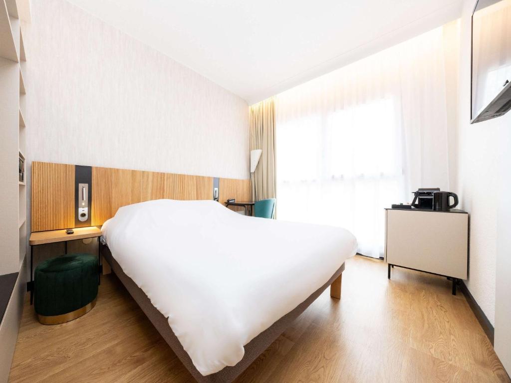 Postel nebo postele na pokoji v ubytování Novotel Suites Montpellier Antigone
