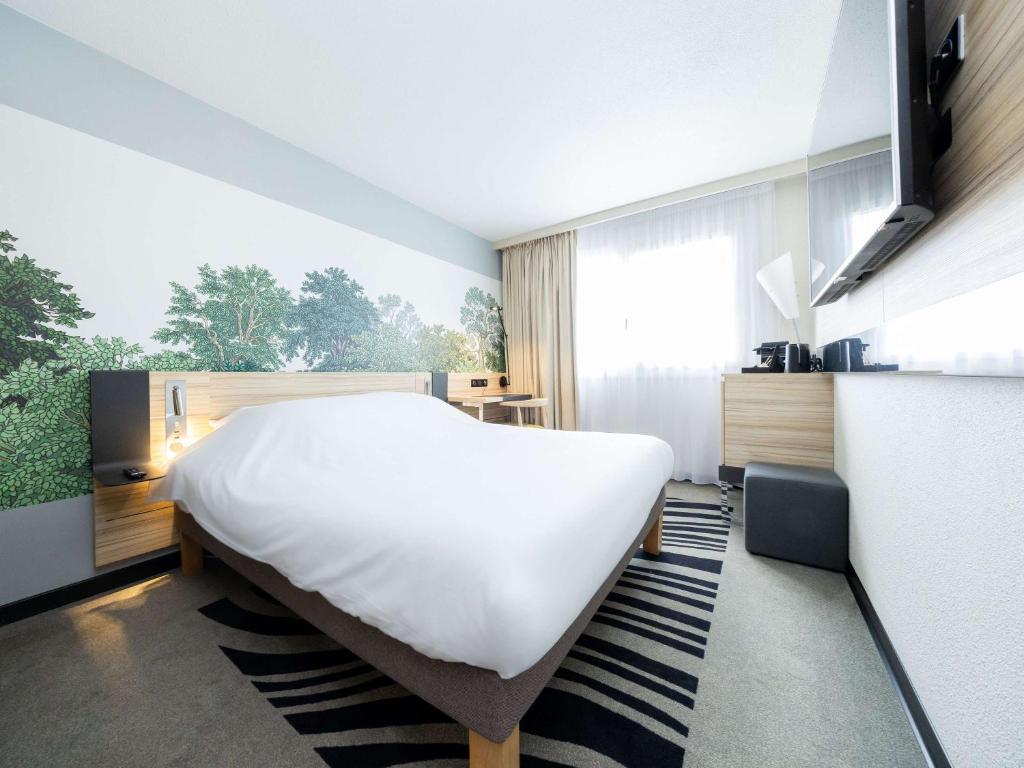 TV a/nebo společenská místnost v ubytování Novotel Suites Montpellier Antigone