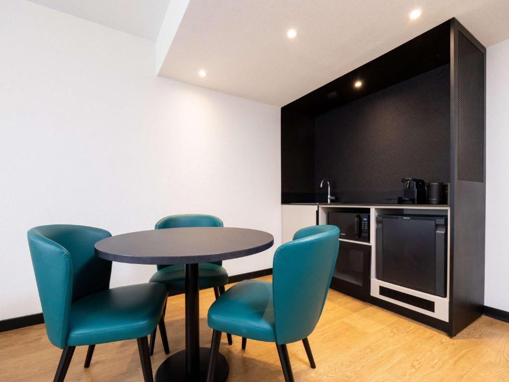 Kuchyň nebo kuchyňský kout v ubytování Novotel Suites Montpellier Antigone