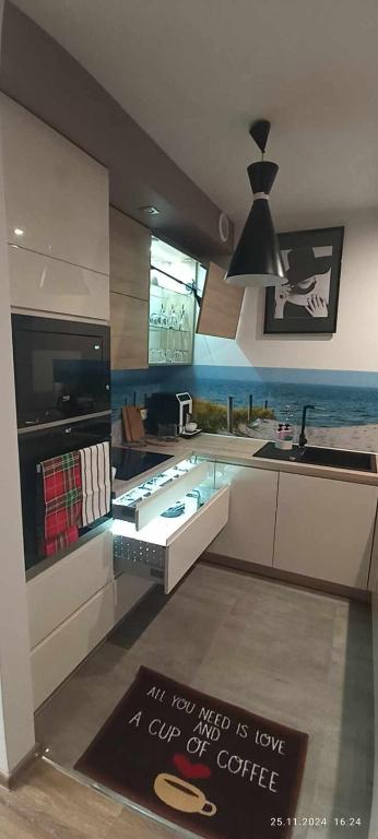 a kitchen with a sink and a counter top at LECH Home APARTAMENT NA GÓRZE in Wisła