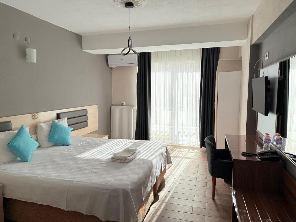 Postel nebo postele na pokoji v ubytování Figen Suite Hotel 2