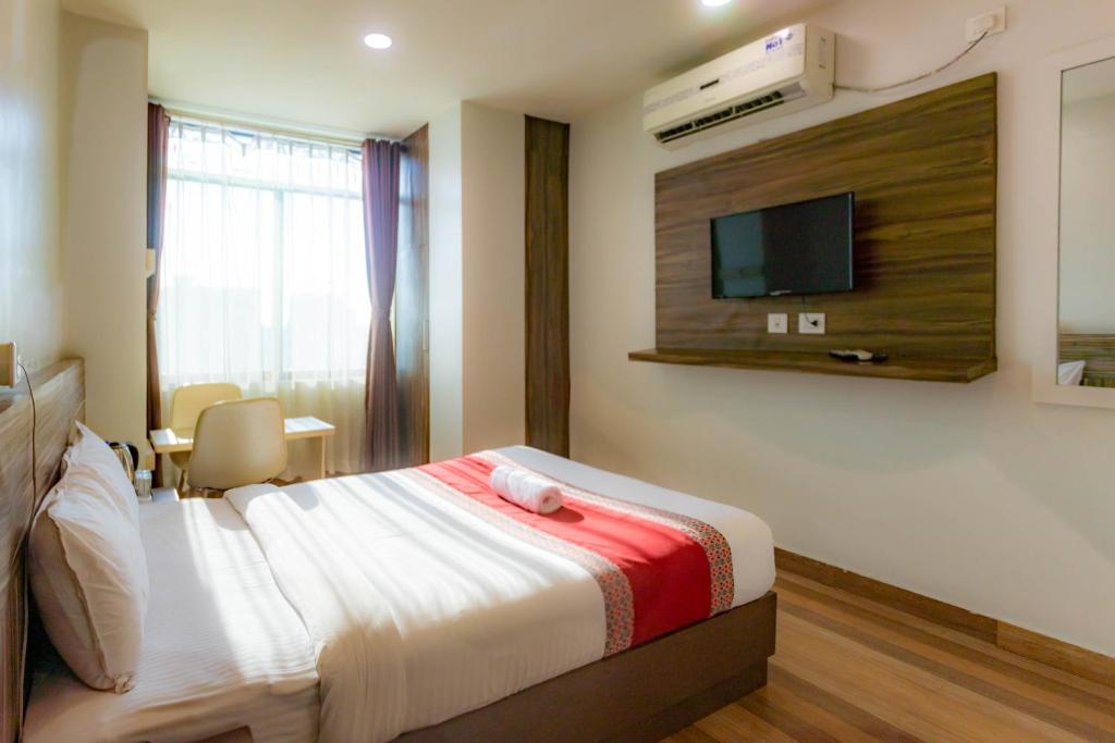 Postel nebo postele na pokoji v ubytování The SR Hotel