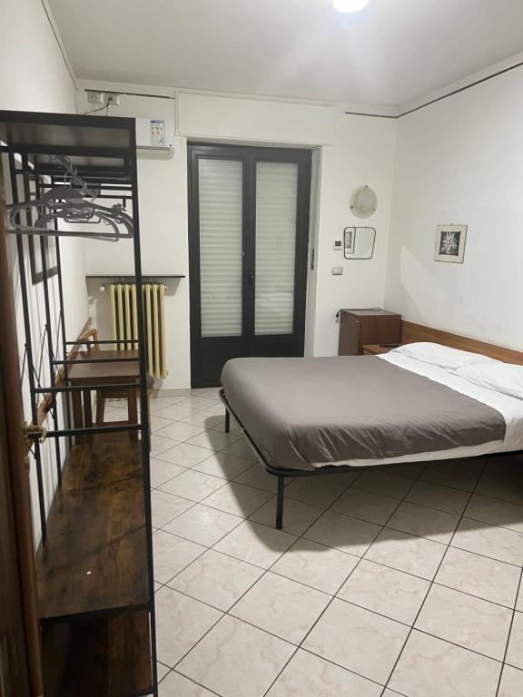 Postel nebo postele na pokoji v ubytování Hotel Persico