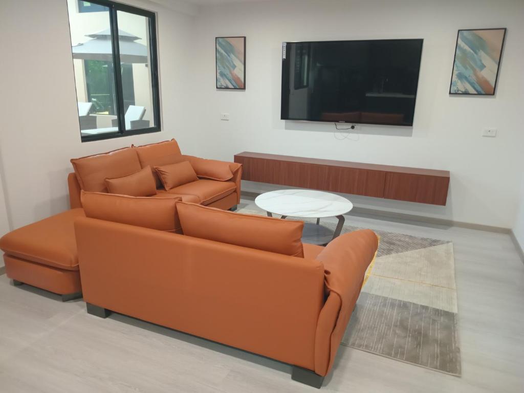 TV o dispositivi per l'intrattenimento presso Hibiscus Suites And Residences