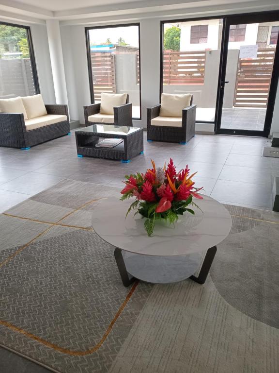 Area soggiorno di Hibiscus Suites And Residences