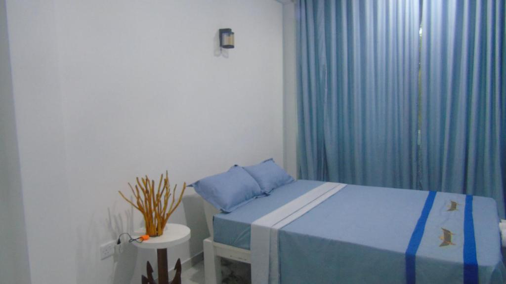 Postel nebo postele na pokoji v ubytování Ro Rich Hotel