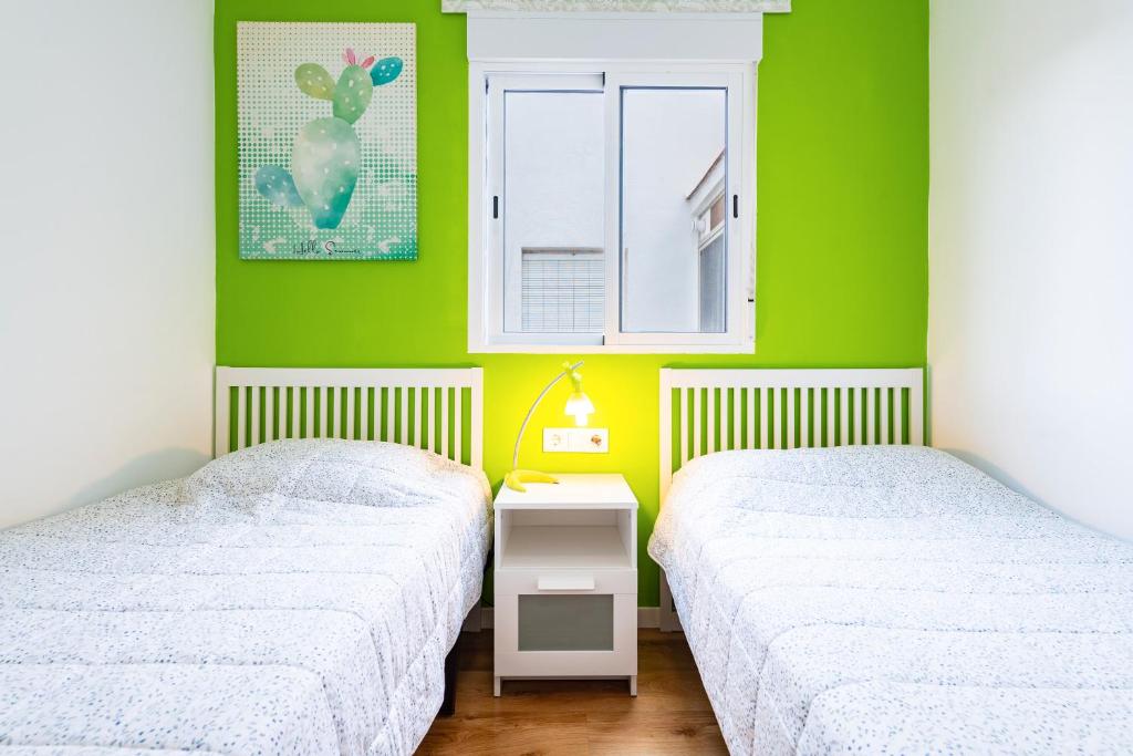 A bed or beds in a room at Apartamento Caracola