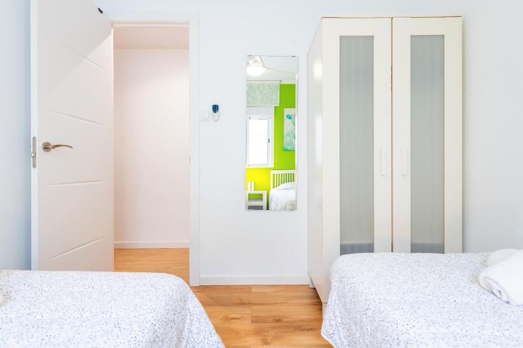 A bed or beds in a room at Apartamento Caracola