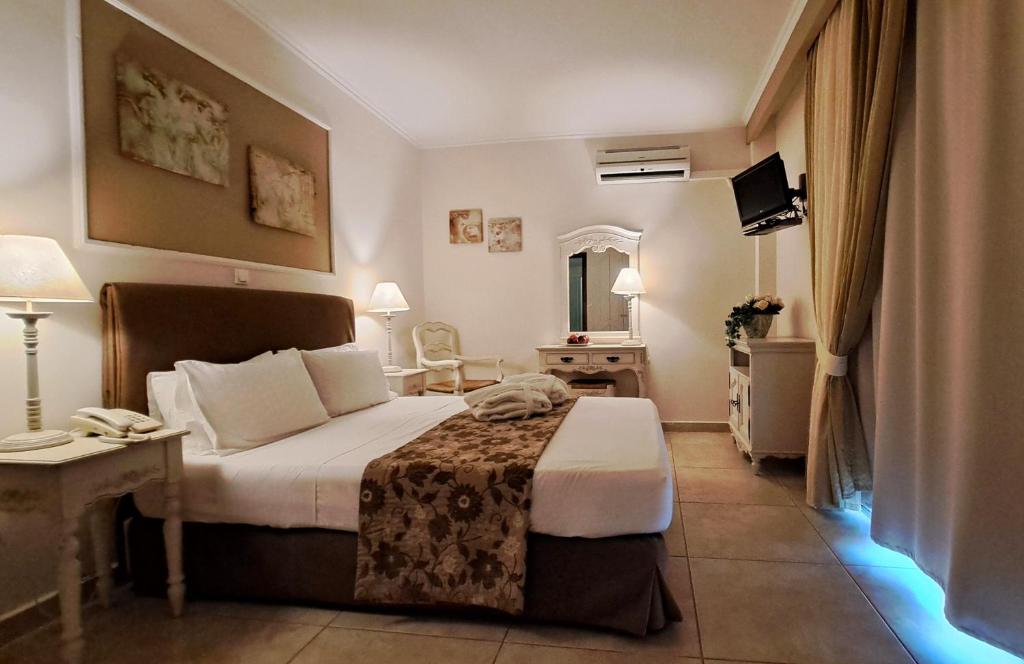 Postel nebo postele na pokoji v ubytování Hotel Astron Princess
