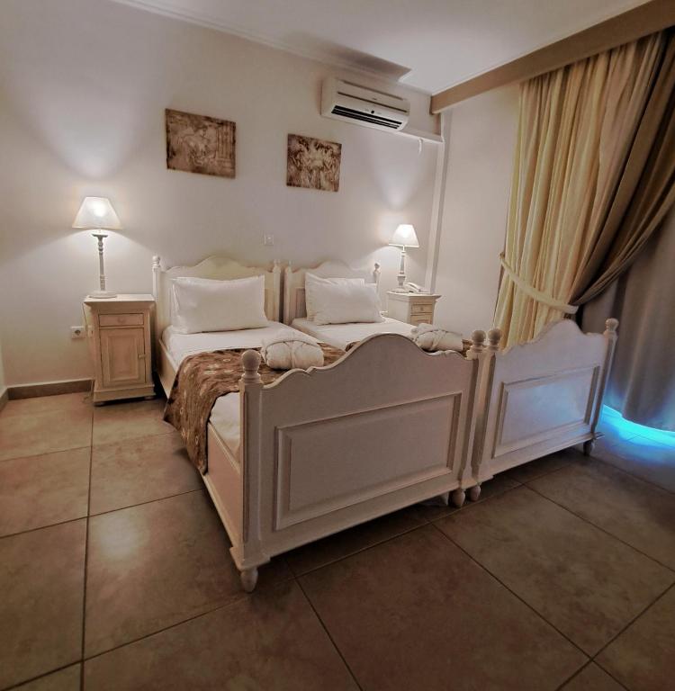 Postel nebo postele na pokoji v ubytování Hotel Astron Princess