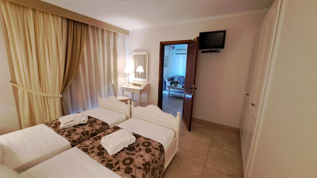 Postel nebo postele na pokoji v ubytování Hotel Astron Princess