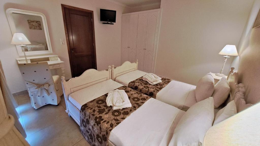 Postel nebo postele na pokoji v ubytování Hotel Astron Princess