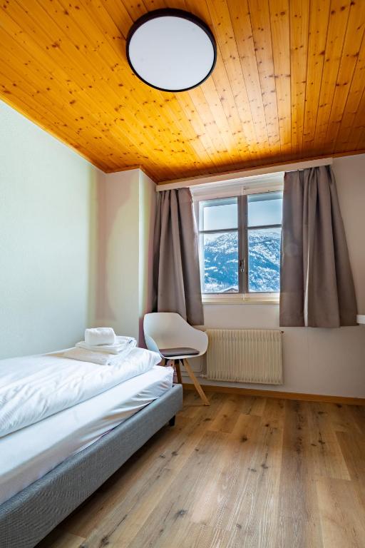 Postel nebo postele na pokoji v ubytování Hotel Restaurant Simplon