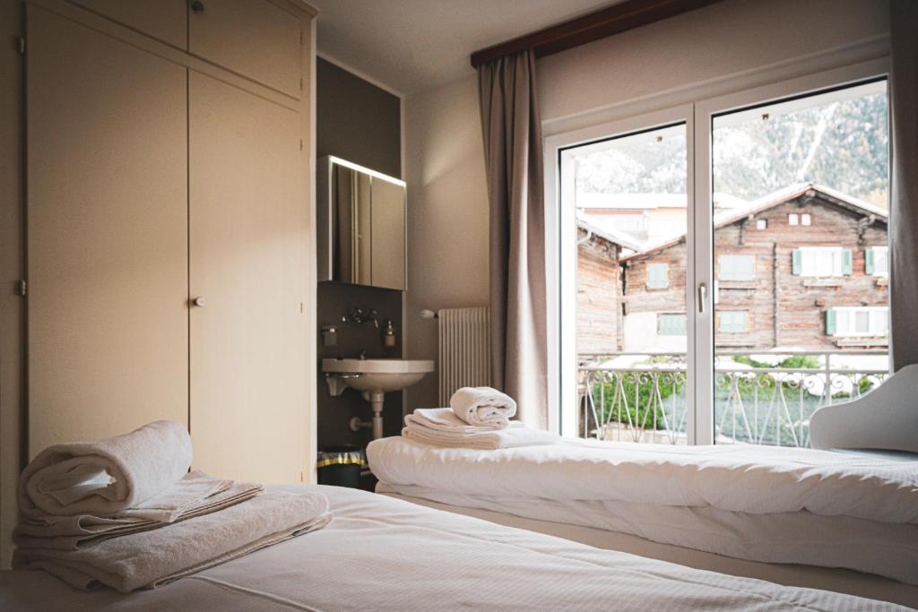 Postel nebo postele na pokoji v ubytování Hotel Restaurant Simplon