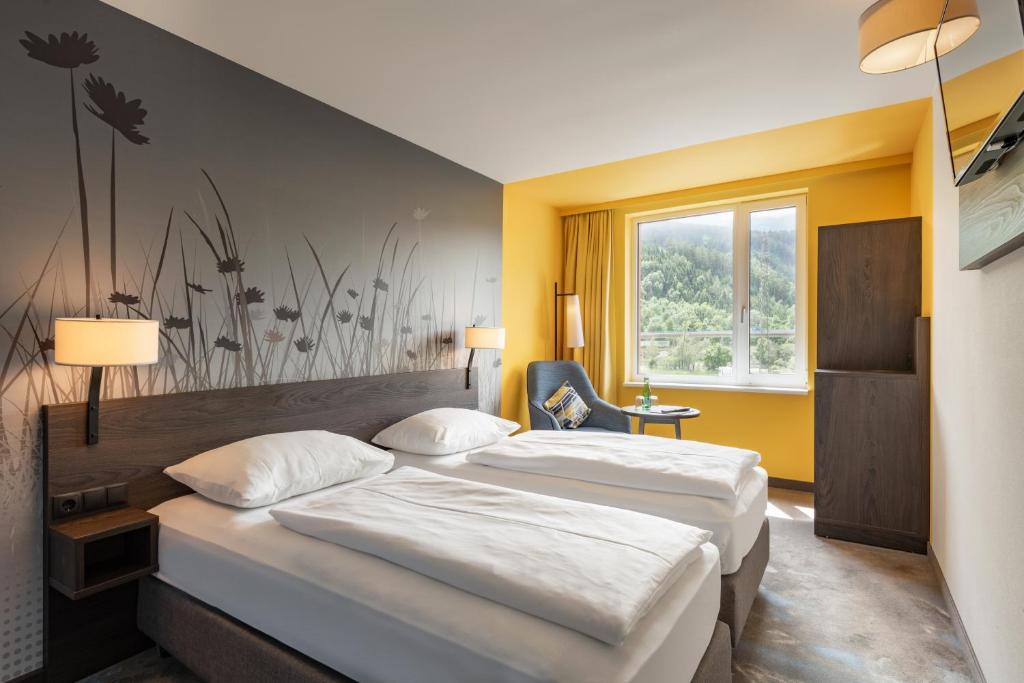 Postel nebo postele na pokoji v ubytování Hwest Hotel