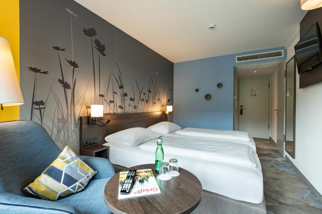 Postel nebo postele na pokoji v ubytování Hwest Hotel