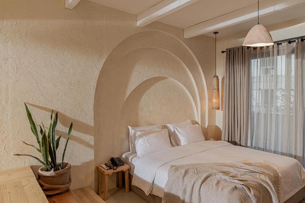 En eller flere senge i et værelse på Serab Residencia, Boutique Hotel & Resort