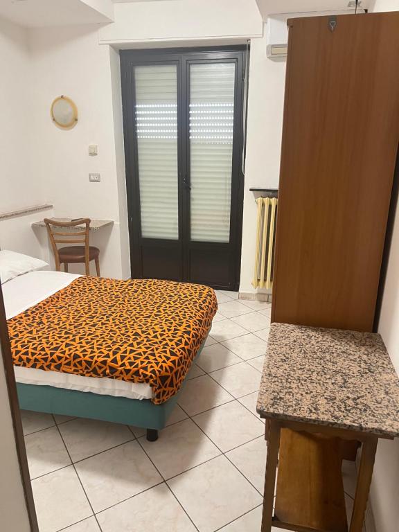 Postel nebo postele na pokoji v ubytování Hotel Persico