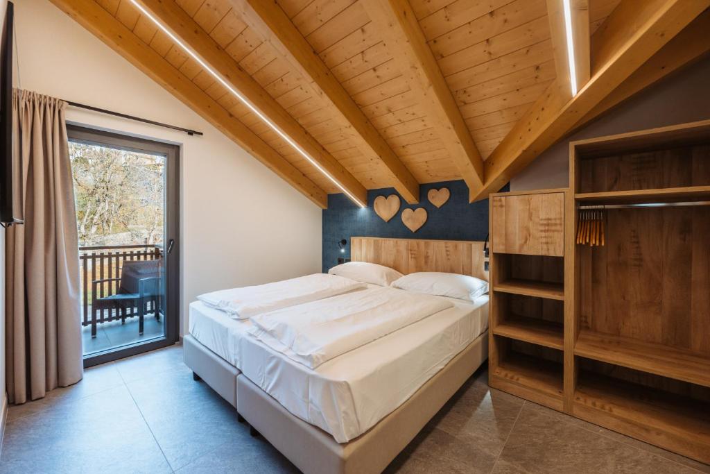 Postel nebo postele na pokoji v ubytování Residence Piz Aot