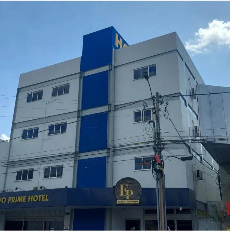 a blue and white building with a sign on it at Executivo Prime Hotel in Teresina