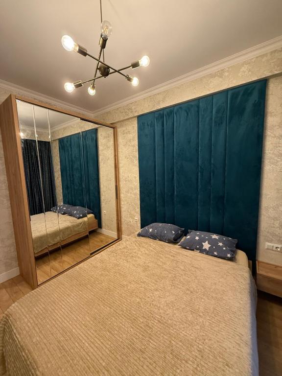 Postel nebo postele na pokoji v ubytování Apartments in Tbilisi Hilton