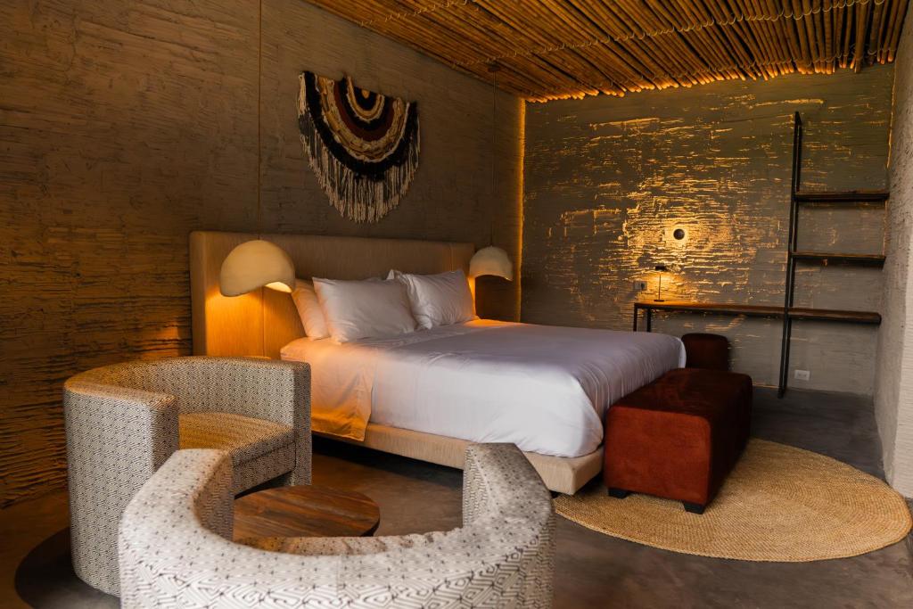 Postel nebo postele na pokoji v ubytování Hotel Casa Tuirak