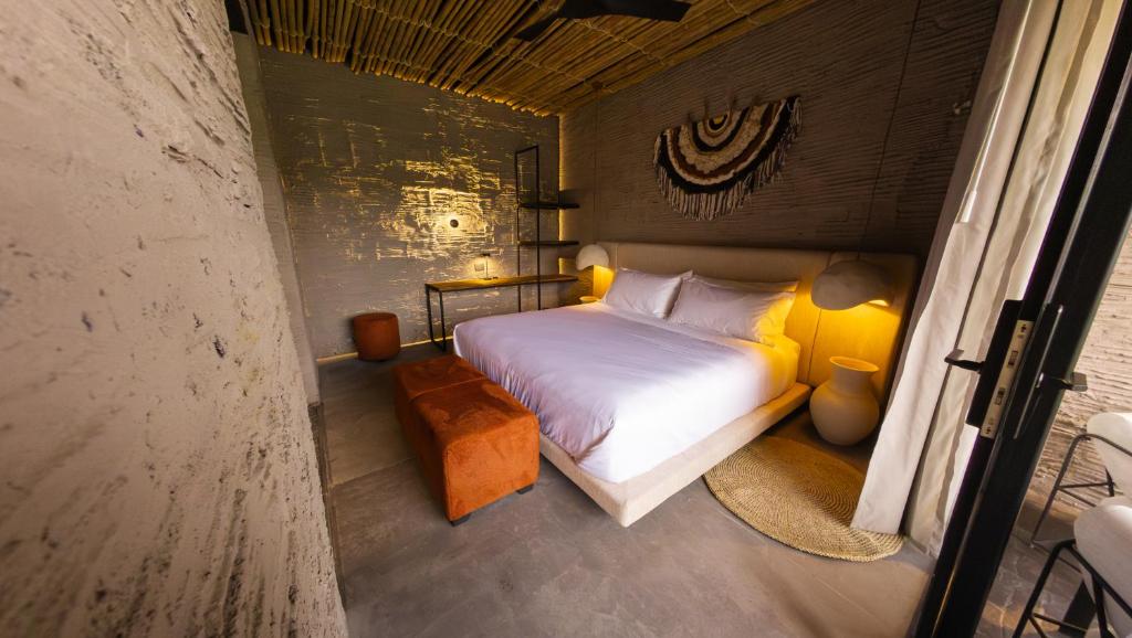 Postel nebo postele na pokoji v ubytování Hotel Casa Tuirak