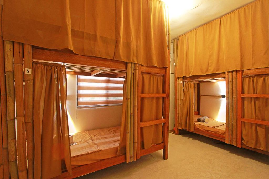 Postel nebo postele na pokoji v ubytování Yellow Banana Siargao