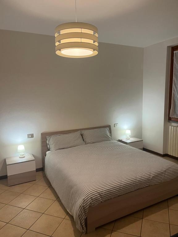 Postel nebo postele na pokoji v ubytování Casa vacanze due laghi cadrezzate