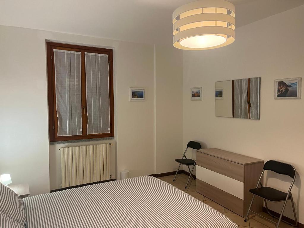 Postel nebo postele na pokoji v ubytování Casa vacanze due laghi cadrezzate