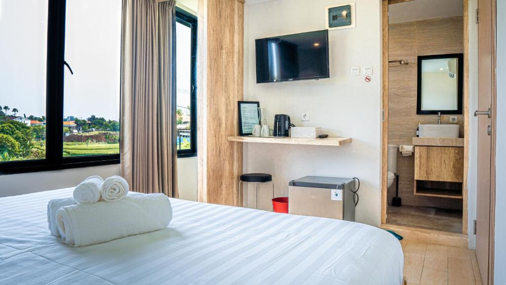 En eller flere senge i et værelse på Allende Canggu