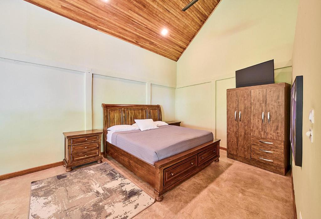 Postel nebo postele na pokoji v ubytování CariPro Apartments