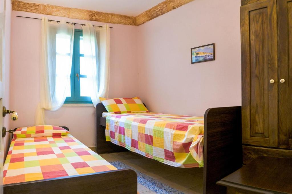 Postel nebo postele na pokoji v ubytování Villa Astrea