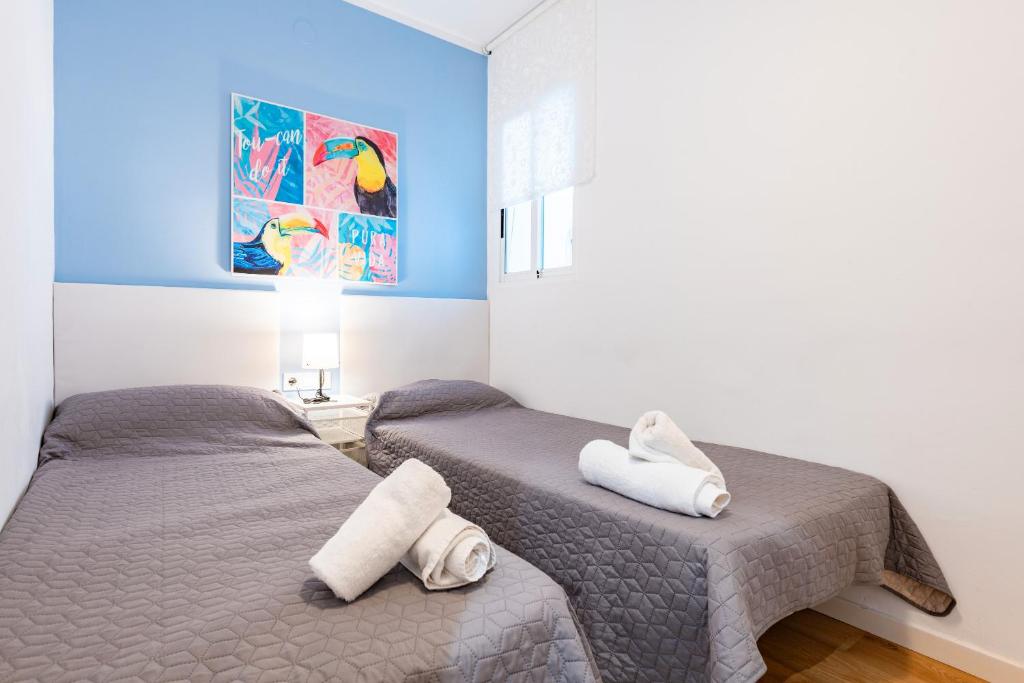 A bed or beds in a room at Apartamento Caracola