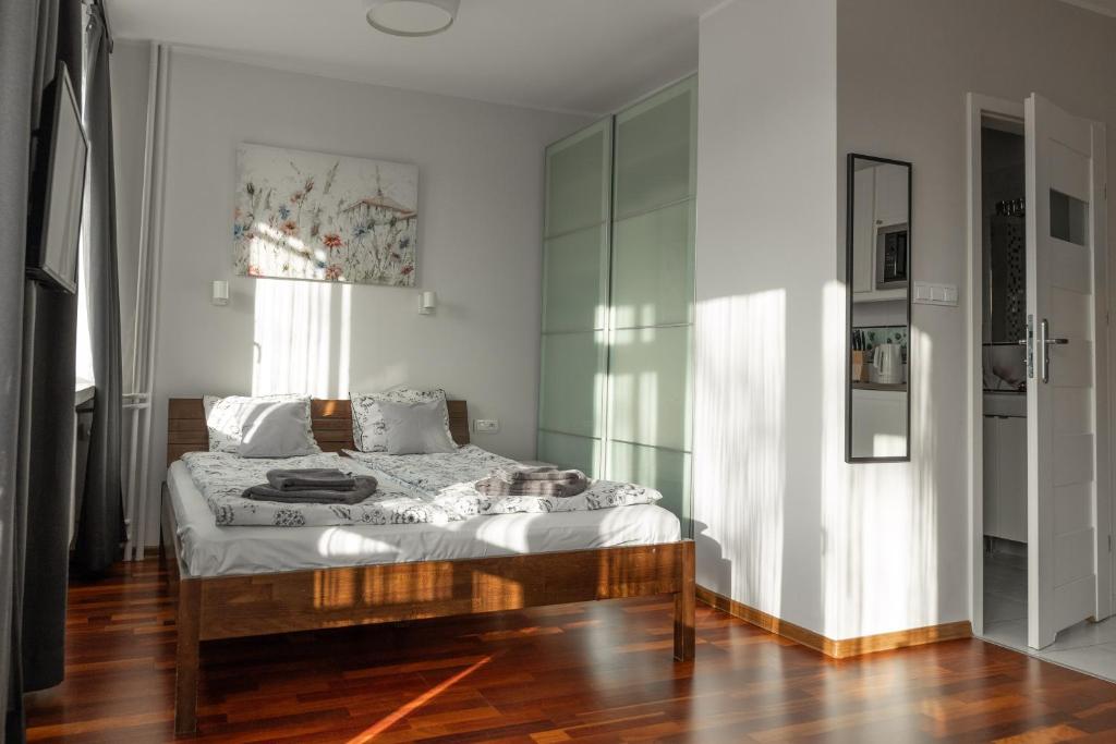 Postel nebo postele na pokoji v ubytování Przytulny Apartament przy Teatrze Wielkim
