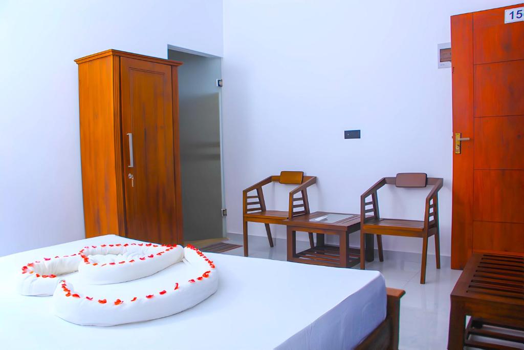 Postel nebo postele na pokoji v ubytování Single Fin Weligama
