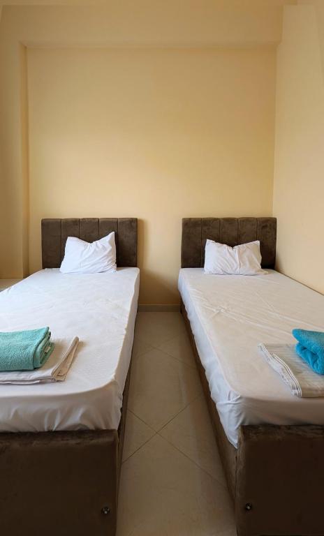 Postel nebo postele na pokoji v ubytování Karima House