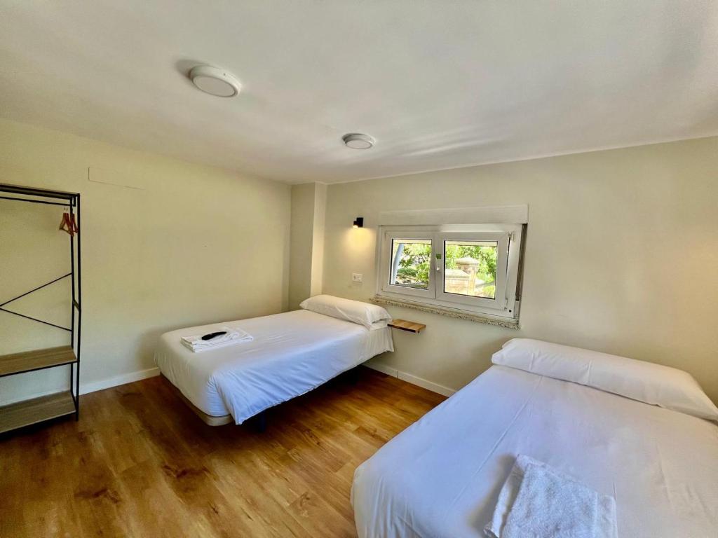 Letto o letti in una camera di Hostal Mindanao