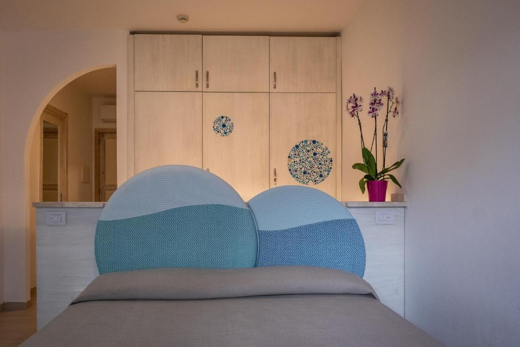 Postel nebo postele na pokoji v ubytování Hotel Corallaro