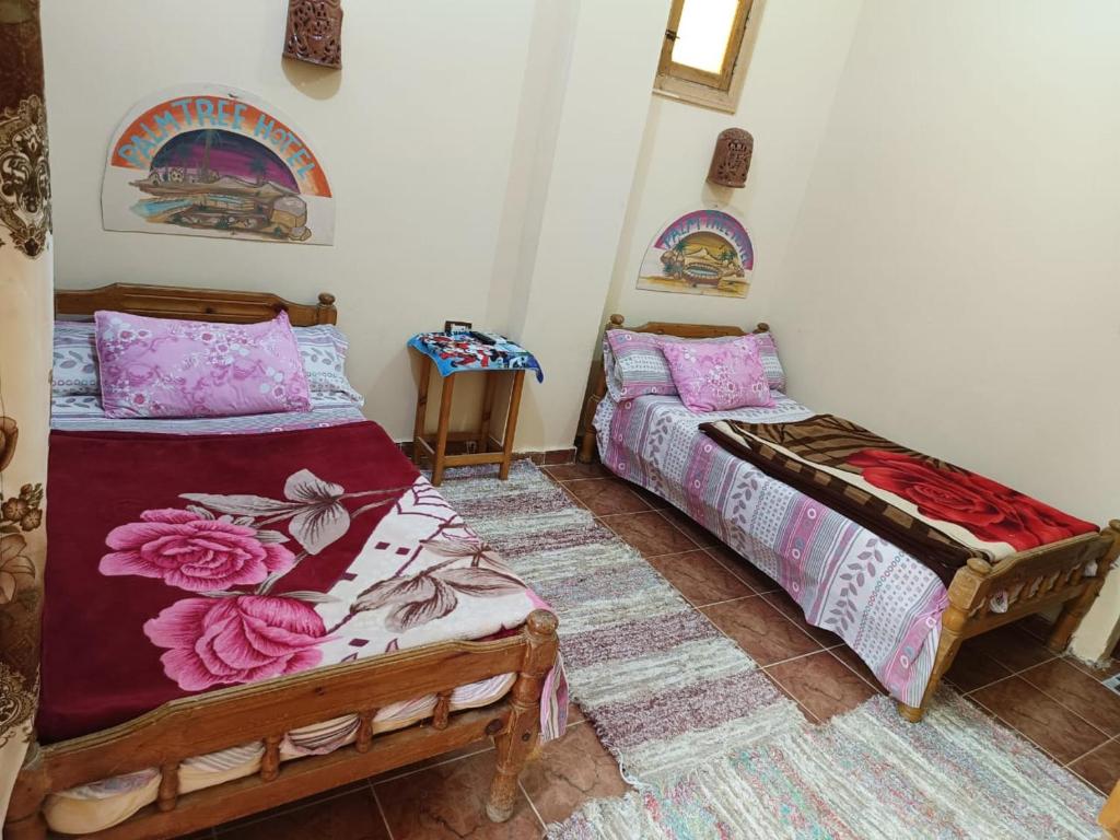 Postel nebo postele na pokoji v ubytování فندق النخيل